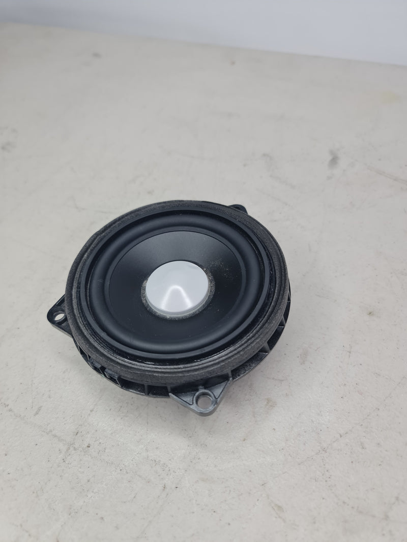BMW mid-range speaker with Harman Kardon branding, compatible with 2012-2020 models, showing the speaker unit with branding details.