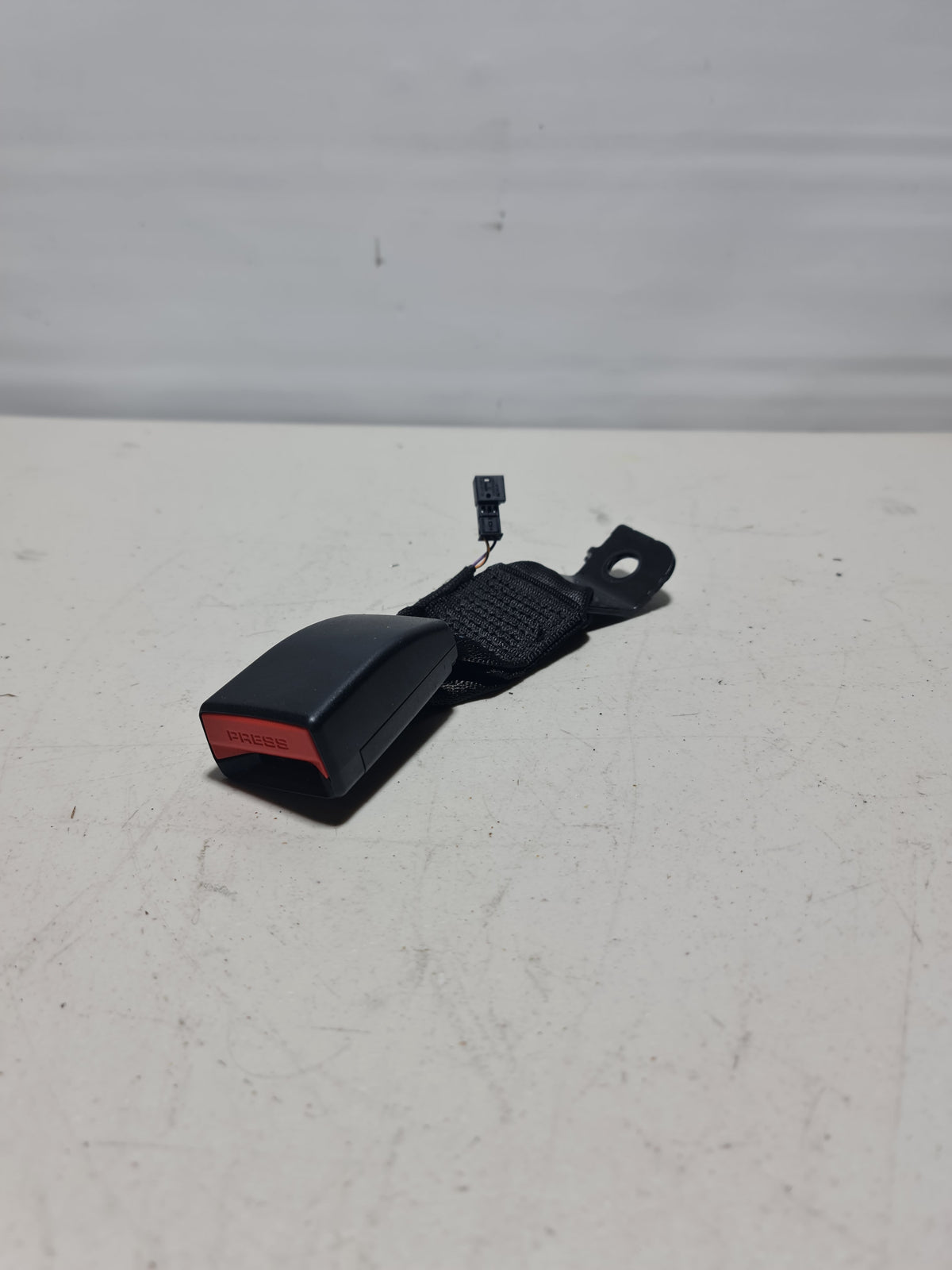 BMW rear left lower seat belt buckle for 2012-2019 models, genuine part with product number 72-11-7-266-352.