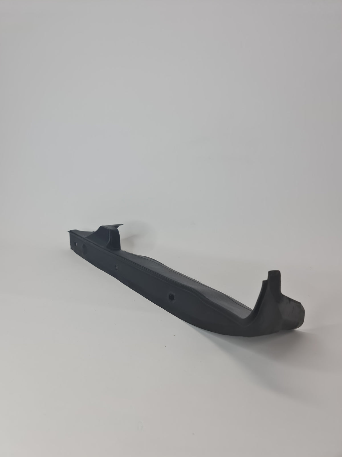 BMW M2 sealing side panel left for 2019-2020 model, showing the black metal panel with mounting edges and sealant areas.