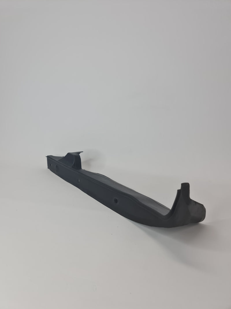 BMW M2 sealing side panel left for 2019-2020 model, showing the black metal panel with mounting edges and sealant areas.