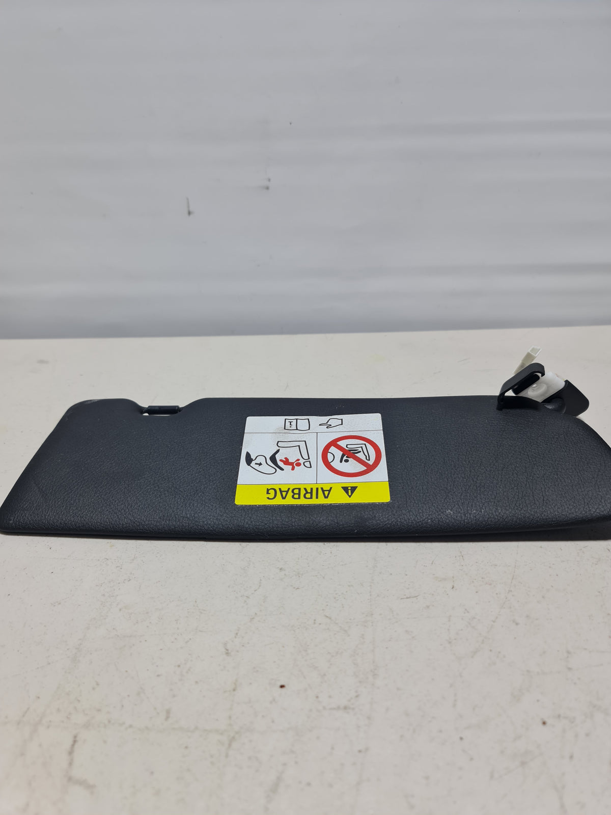 Original BMW left sun visor without label, model 8057937, designed for BMW vehicles, shown in a close-up image