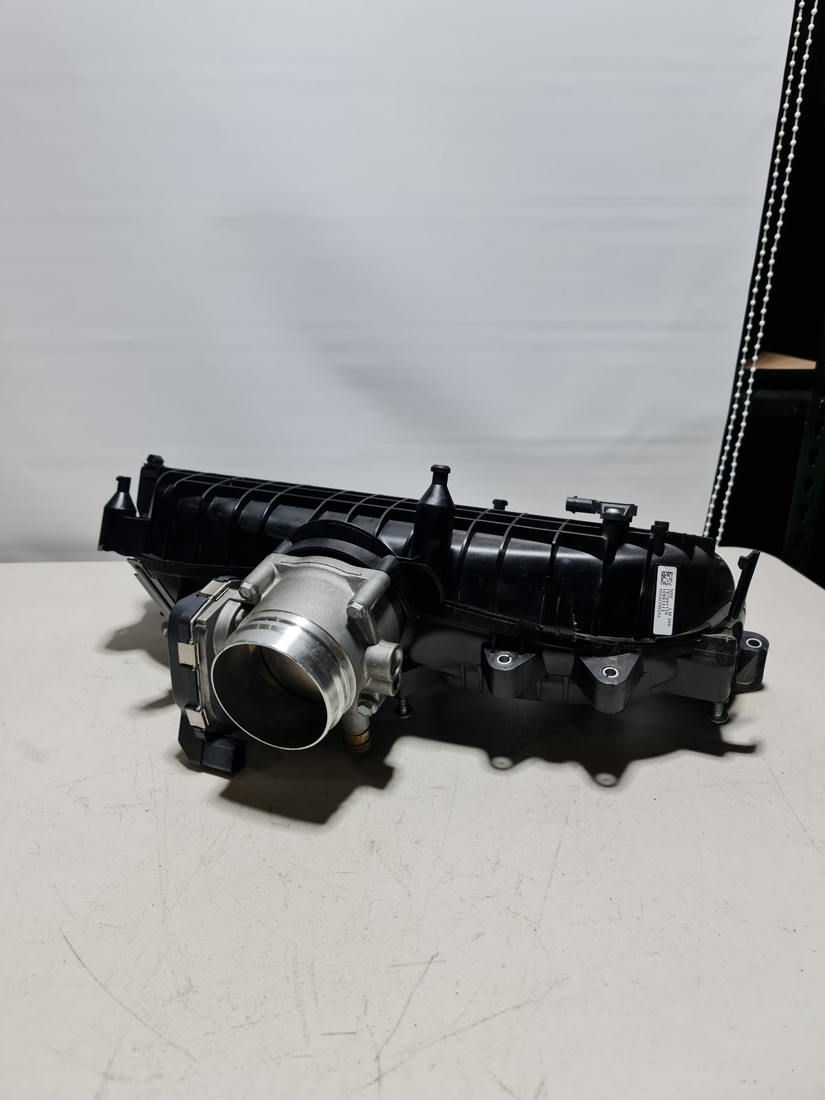 BMW throttle housing assembly for 2010-2020 models, part number 13-54-7-597-871, includes throttle body and related components.
