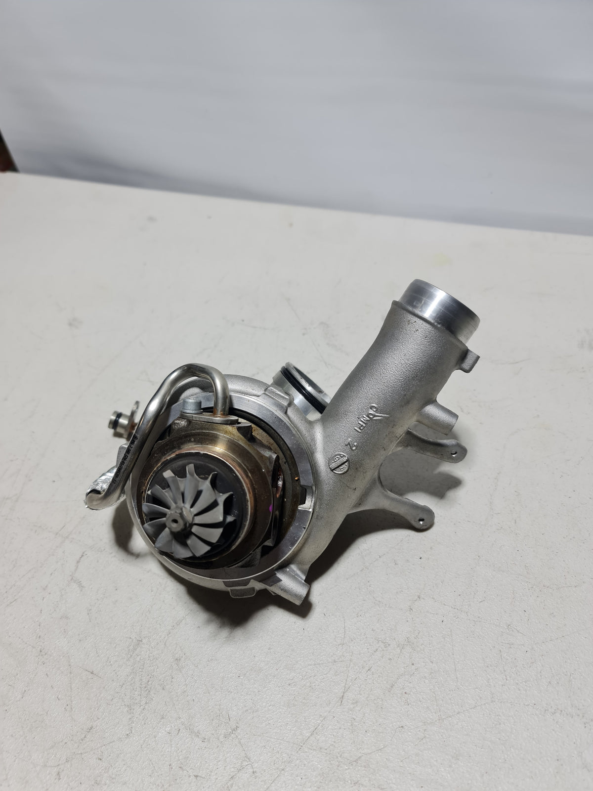 BMW turbocharger with exhaust manifold for cylinders 1-3, compatible with 2015-2020 BMW models, black metal component.