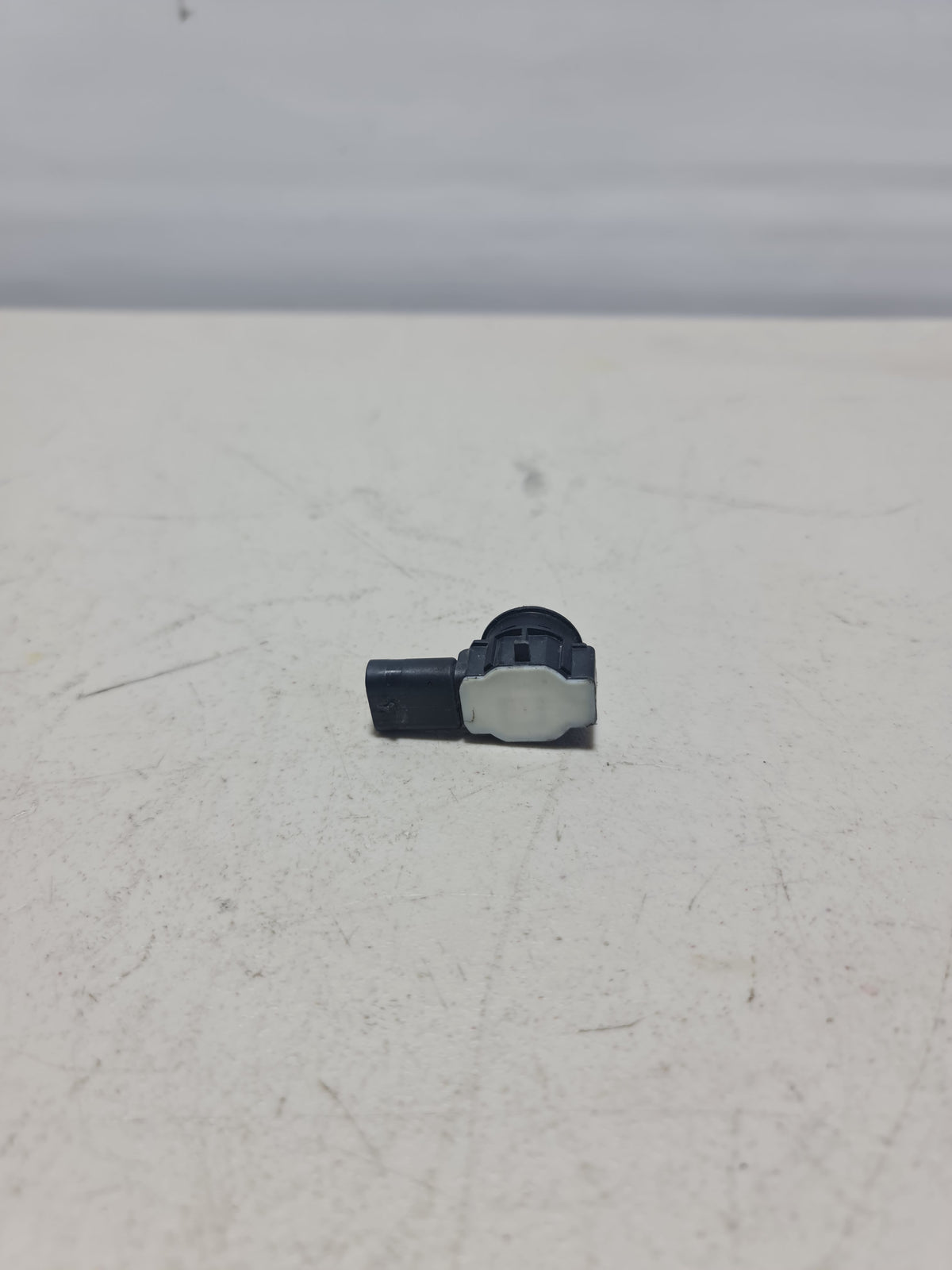 BMW ultrasonic sensor in black for 2012-2020 models, part number 66-20-9-261-582, shown installed on vehicle.