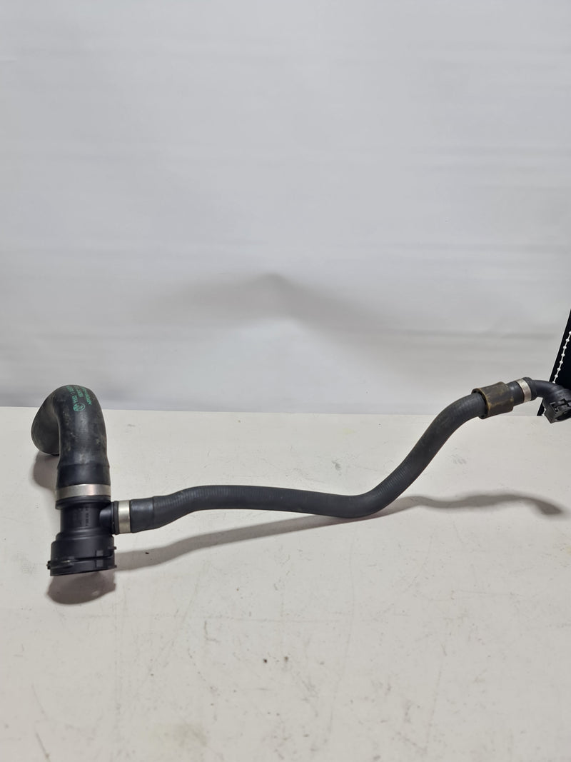 BMW upper radiator coolant hose pipe line for 2015-2020 models, connecting engine to radiator, made by BMW.