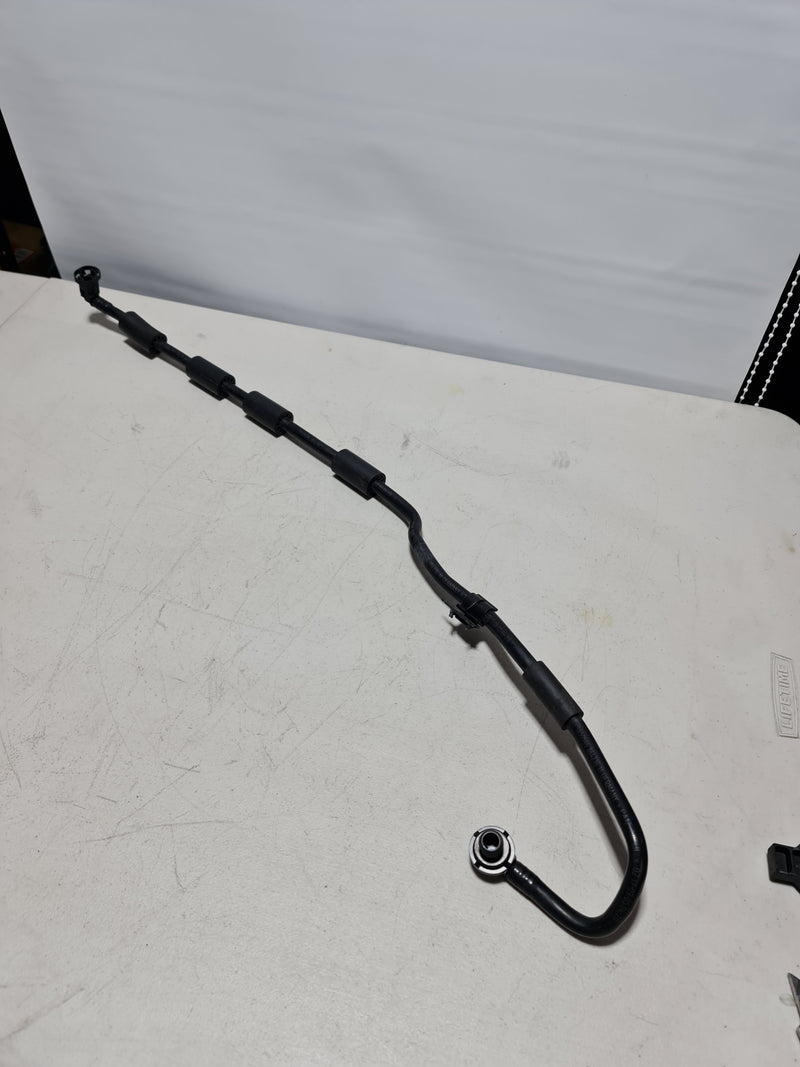 BMW M3 F80 2018 brake booster servo vacuum hose line pipe, automotive engine component with hoses and fittings.