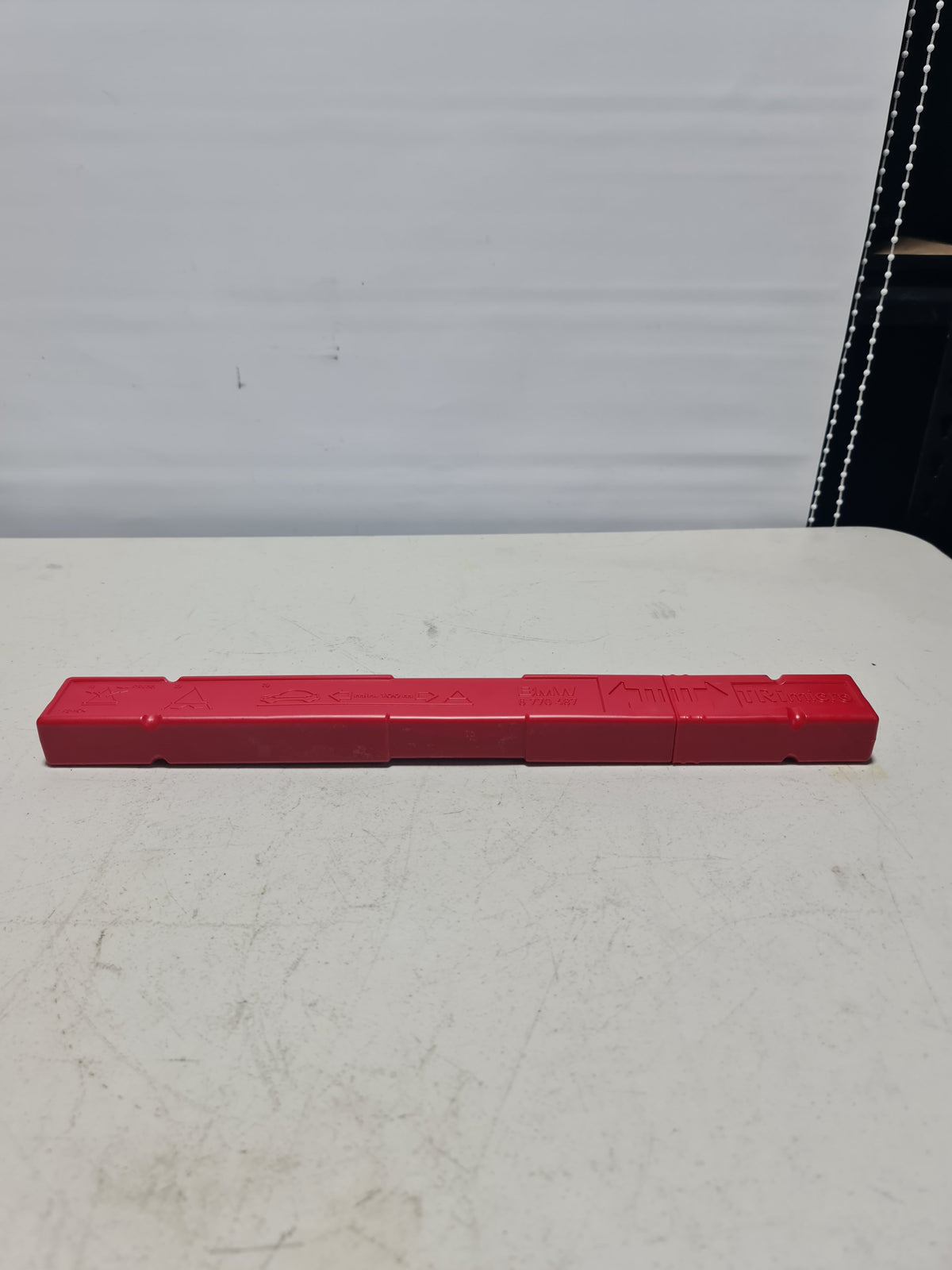 BMW warning triangle with container, compatible with 1995-2020 models, compact emergency roadside safety kit.