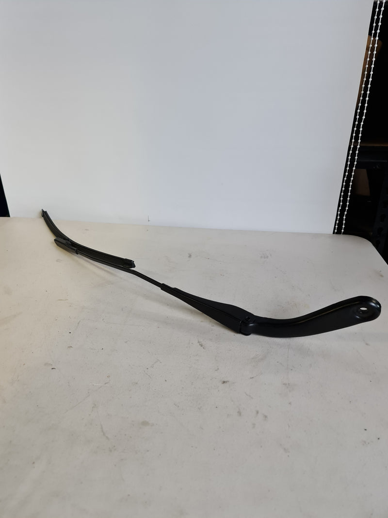 BMW 3 Series F30 F36 passenger side OEM wiper arm and blade, left side, with sleek black finish and attachment point visible.