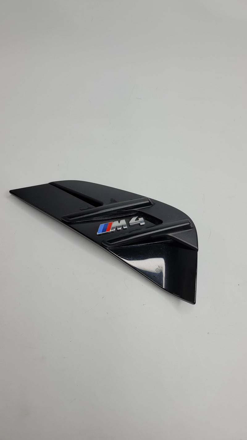 BMW M4 G82 G83 MPerformance.parts front right side air breather, close-up of black plastic automotive air intake component.