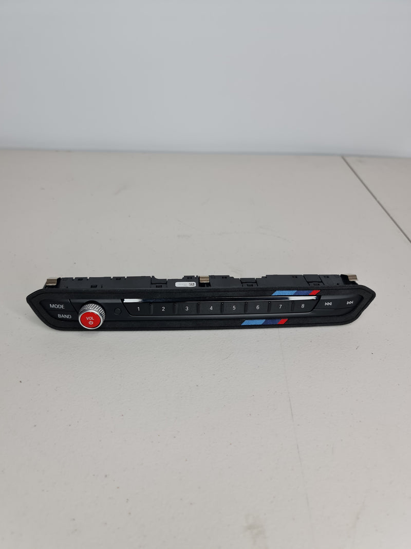 BMW G80 OEM Audio Operating Unit in black, MPerformance.parts, with buttons and display visible for enhanced audio control.