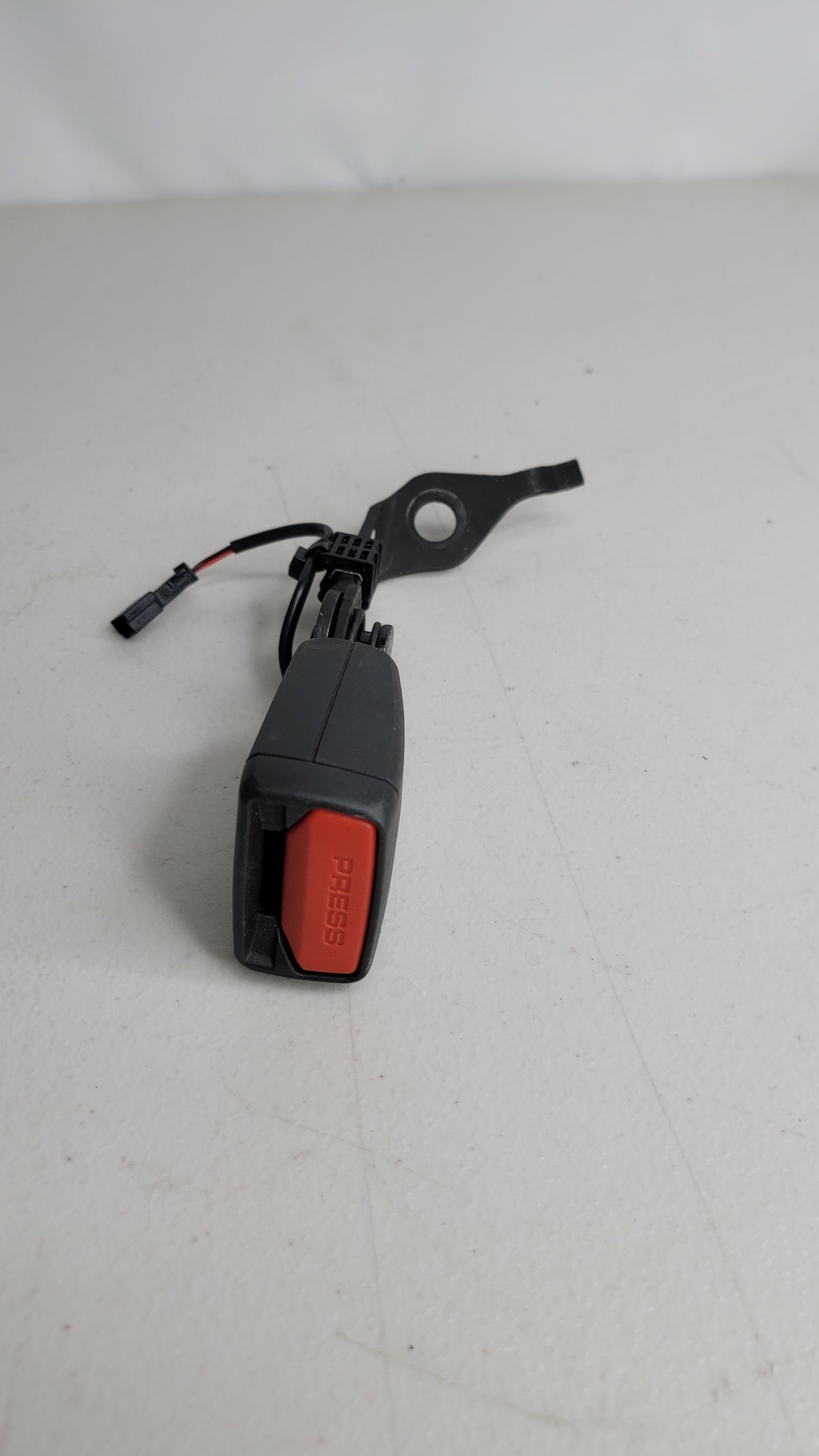 BMW G22 G82 rear right passenger side seat buckle by MPerformance.parts, showing close-up of the seat buckle component.