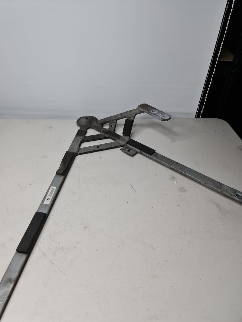 BMW F80 F82 M3 M4 rear right driver subframe brace by MPerformance.parts, showing the metal brace component installed.