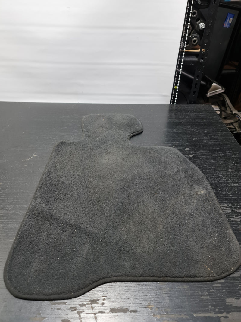 BMW F82 M4 driver floor mat by MPerformance.parts, black rubber mat with textured surface for vehicle protection and style.