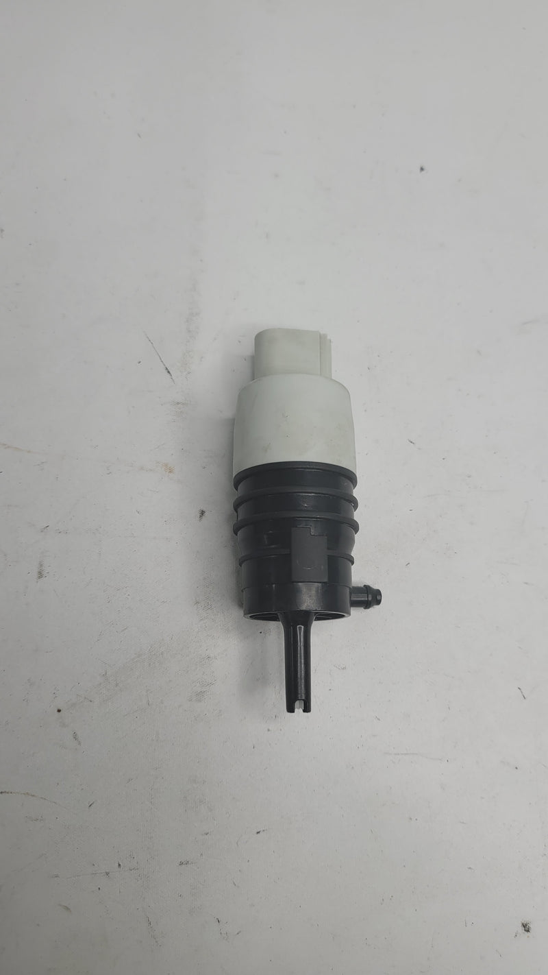 BMW G80 M3 windshield washer pump, part 8736998, shown as a compact black automotive component for windshield cleaning.