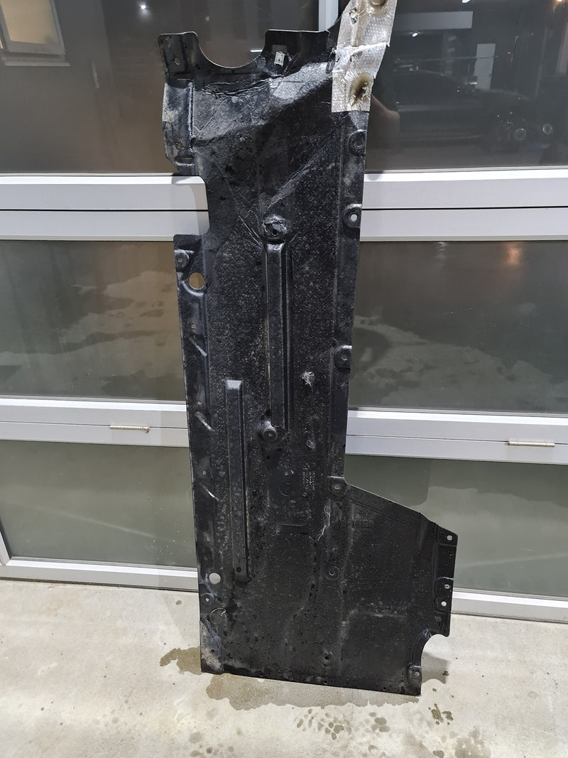 BMW M2 M3 M4 F87 F80 F82 F83 under body panel passenger left side by MPerformance.parts, showing the black metal component.