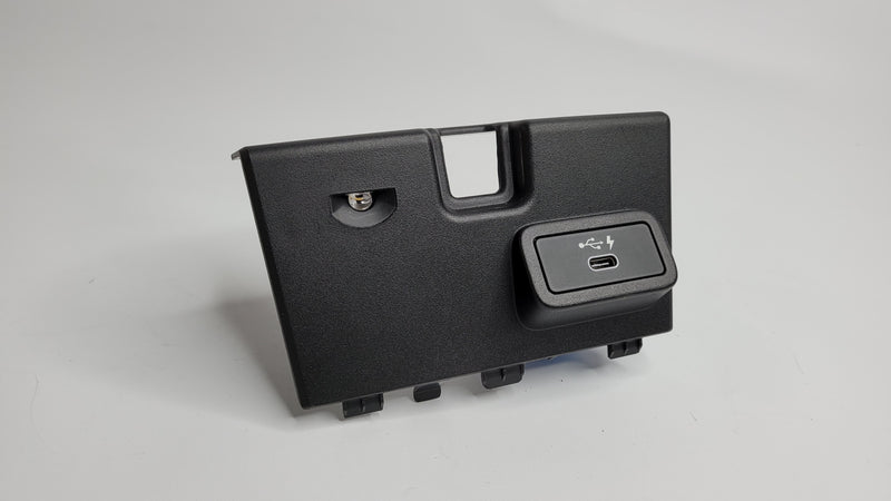 BMW M3 G80 center console insert trim with USB port, MPerformance.parts brand, showcasing the sleek interior detail.