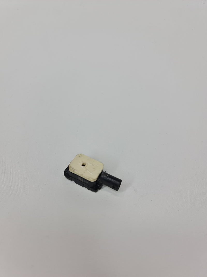 BMW M3 F80 front door impact crash sensor, part number 9217711, shown mounted on vehicle door with wiring connections.