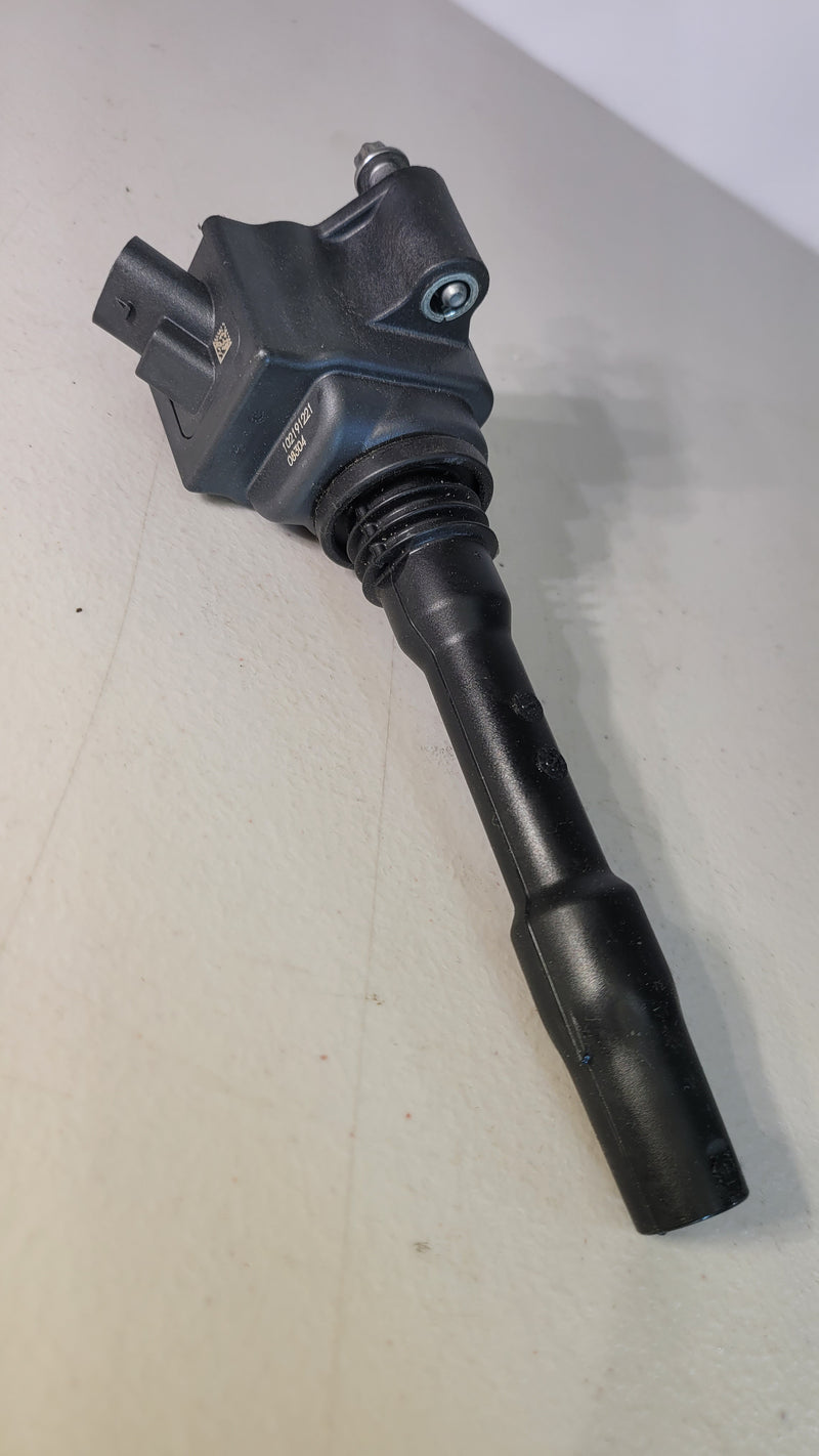 BMW M3 G80 ignition coil by MPerformance.parts, showing the black coil with electrical connectors and branding.
