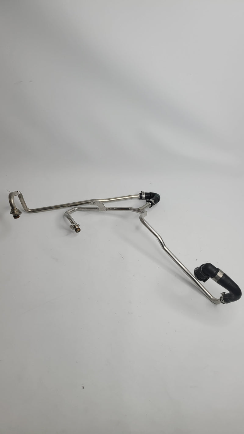 BMW M3 M4 G80 G82 G83 turbo coolant flow line hose by MPerformance.parts, showing the curved rubber hose with metal fittings.