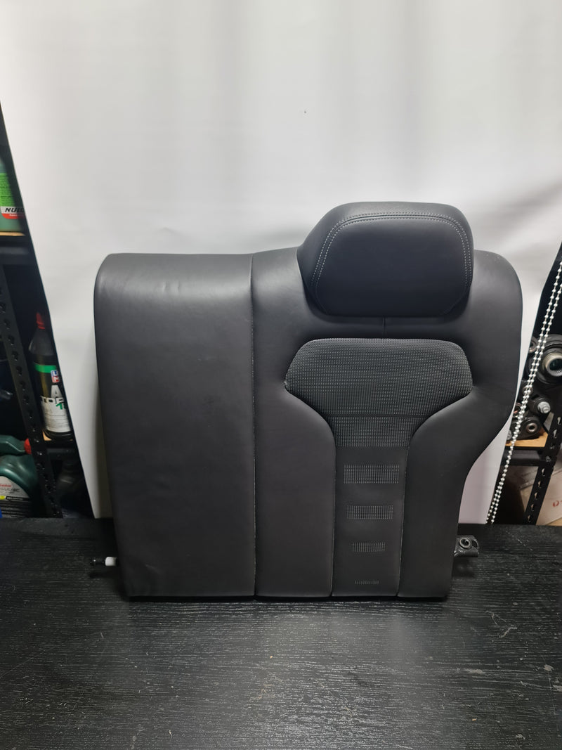 BMW M4 F82 OEM black leather rear seat assembly showing the upholstery and seat structure for the MPerformance.parts product.