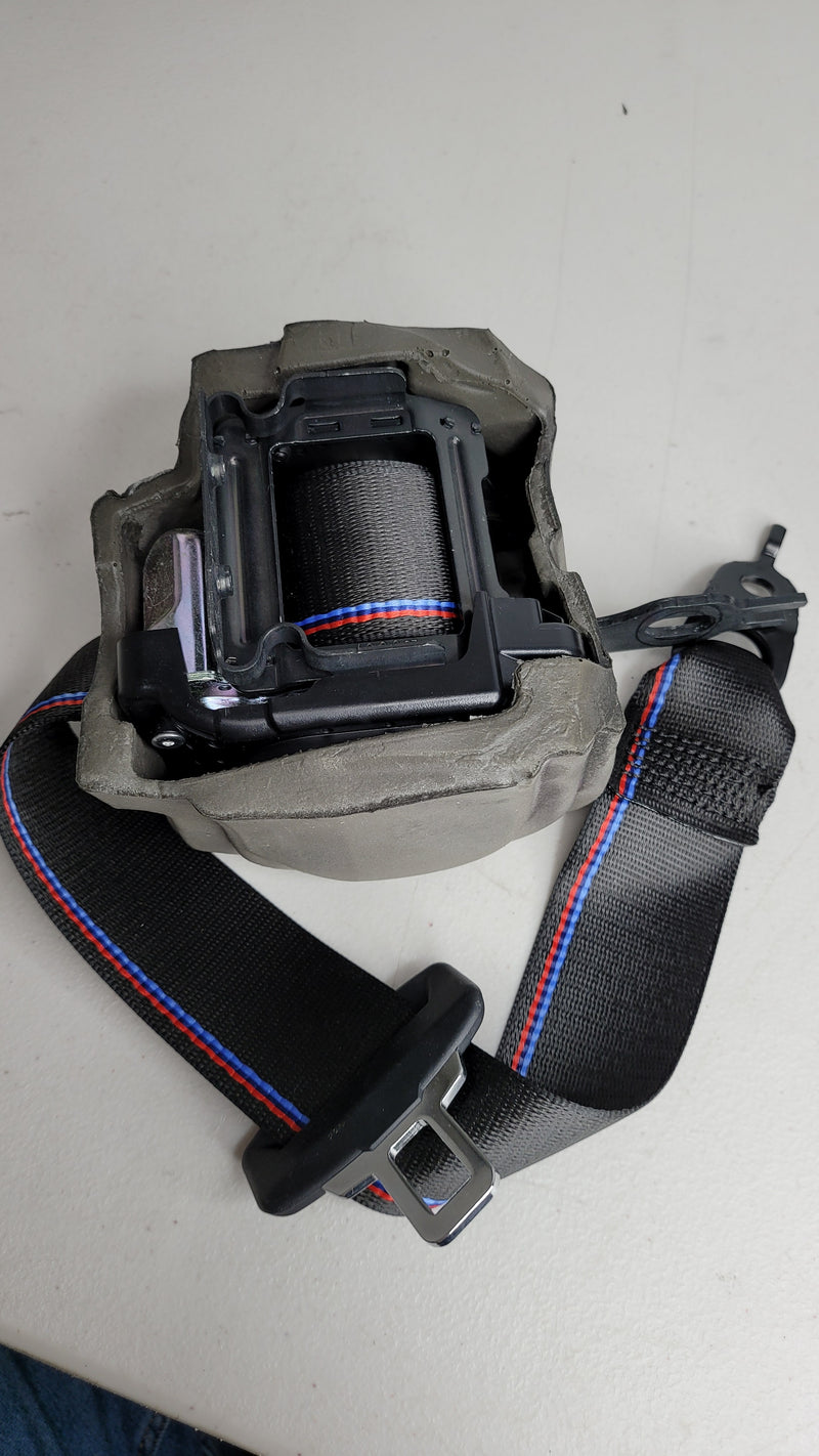 BMW M3 G80 driver side rear right seat belt from MPerformance.parts, showcasing the black seat belt assembly for the vehicle interior.