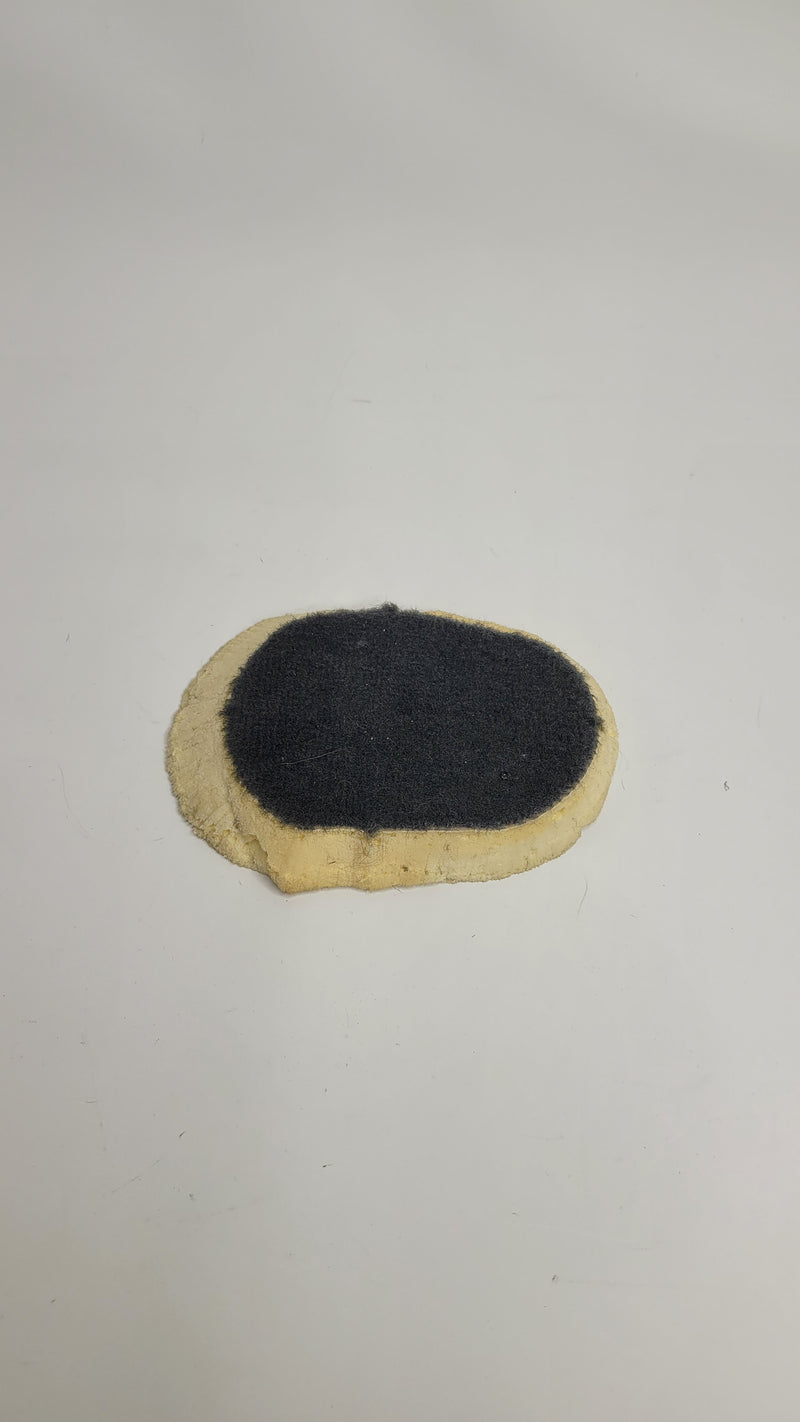 F80 M3 center tunnel carpet piece from MPerformance.parts, showing textured black interior carpet with precise fit and stitching.