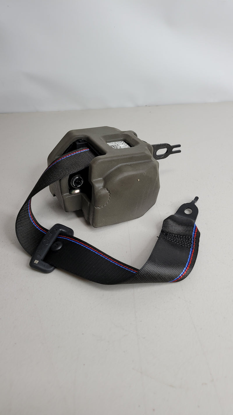BMW G80 rear right seat belt from MPerformance.parts, close-up of the black seat belt assembly with mounting hardware.