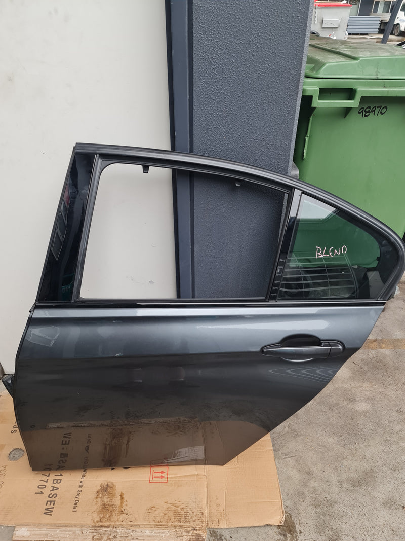 Grey BMW F80 LCI M3 3 Series passenger door by MPerformance.parts, showing the sleek exterior with handle and window frame.