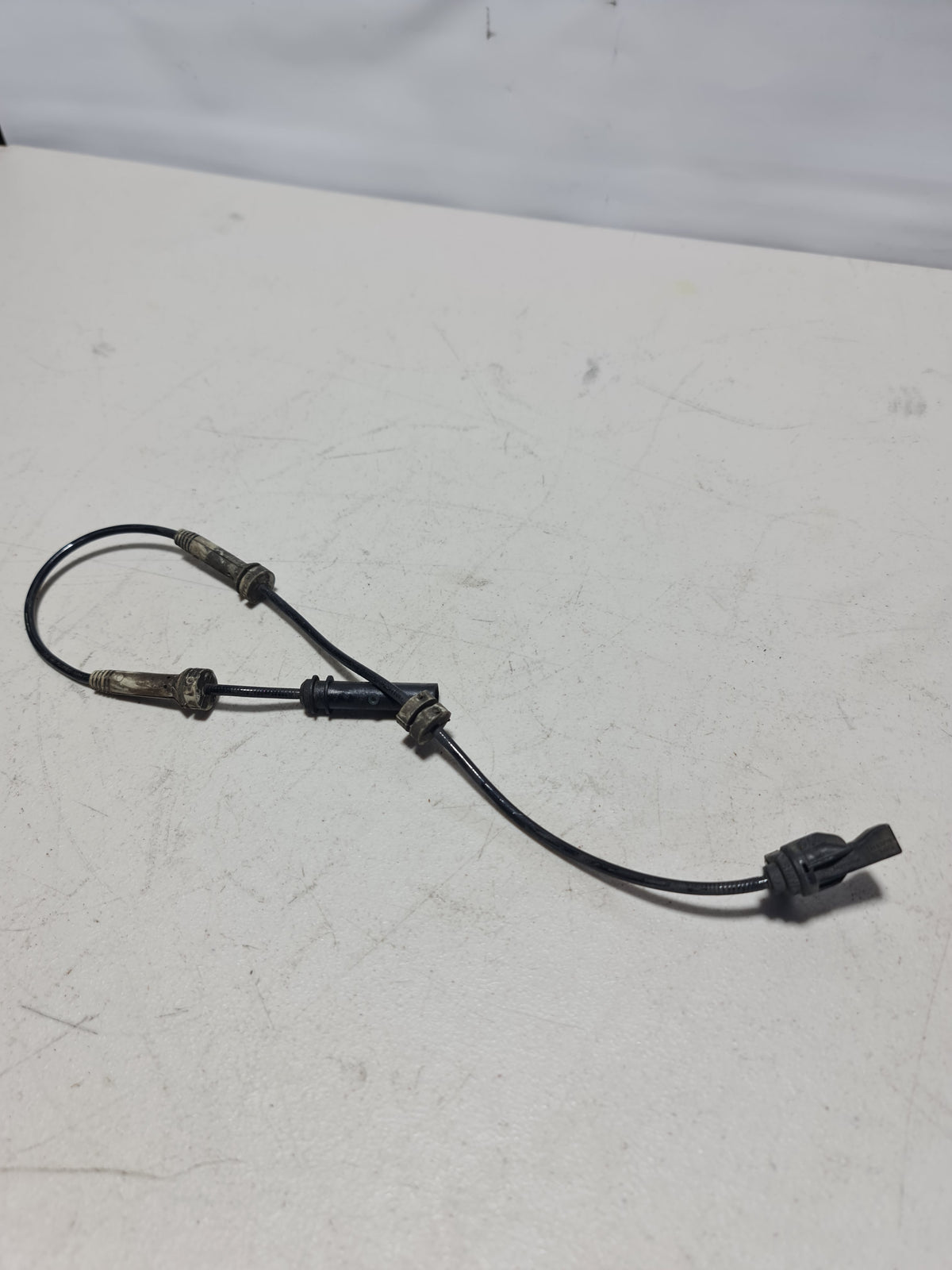 F80 M3 front ABS sensor from MPerformance.parts, showing the sensor with mounting components and wiring for vehicle safety system.