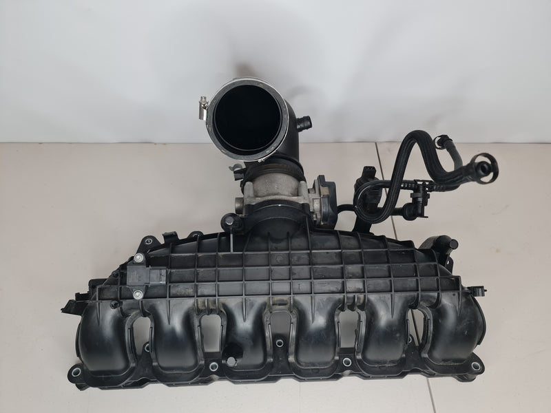 F80 M3 intake manifold with J pipe by MPerformance.parts, showing the black plastic manifold and attached J pipe for engine airflow.
