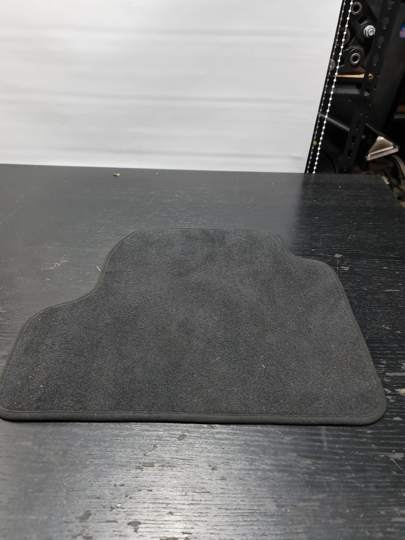 F82 M4 rear right floor mat by MPerformance.parts, black textured automotive floor mat for rear passenger side.