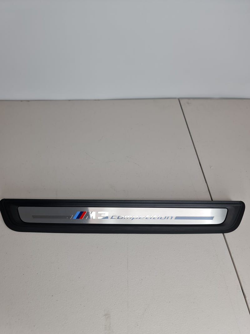 BMW G80 M3 Competition OEM front door sill kick plate by MPerformance.parts, durable black door sill plate with logo.