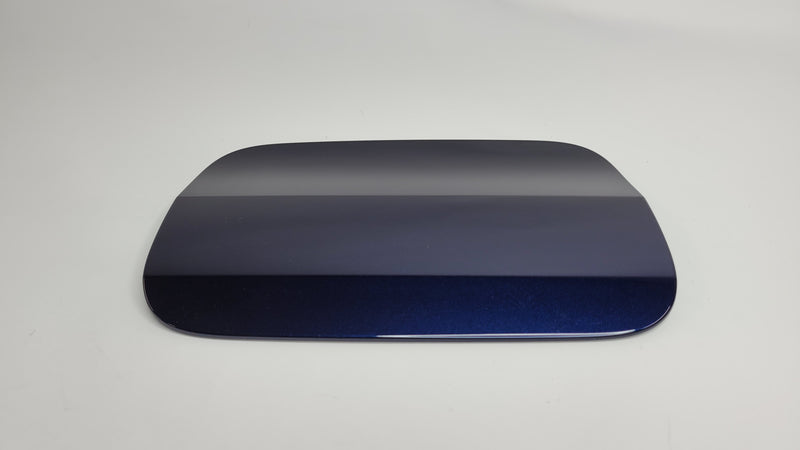 BMW G80 fuel fill-in flap cap cover by MPerformance.parts, close-up of the black plastic fuel cap with branding details.