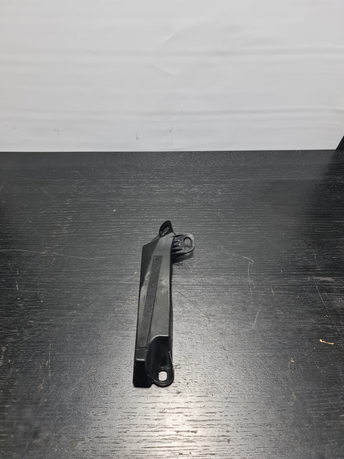 BMW G21 3 Series G20 support left part by MPerformance.parts, shown in black with mounting points visible.