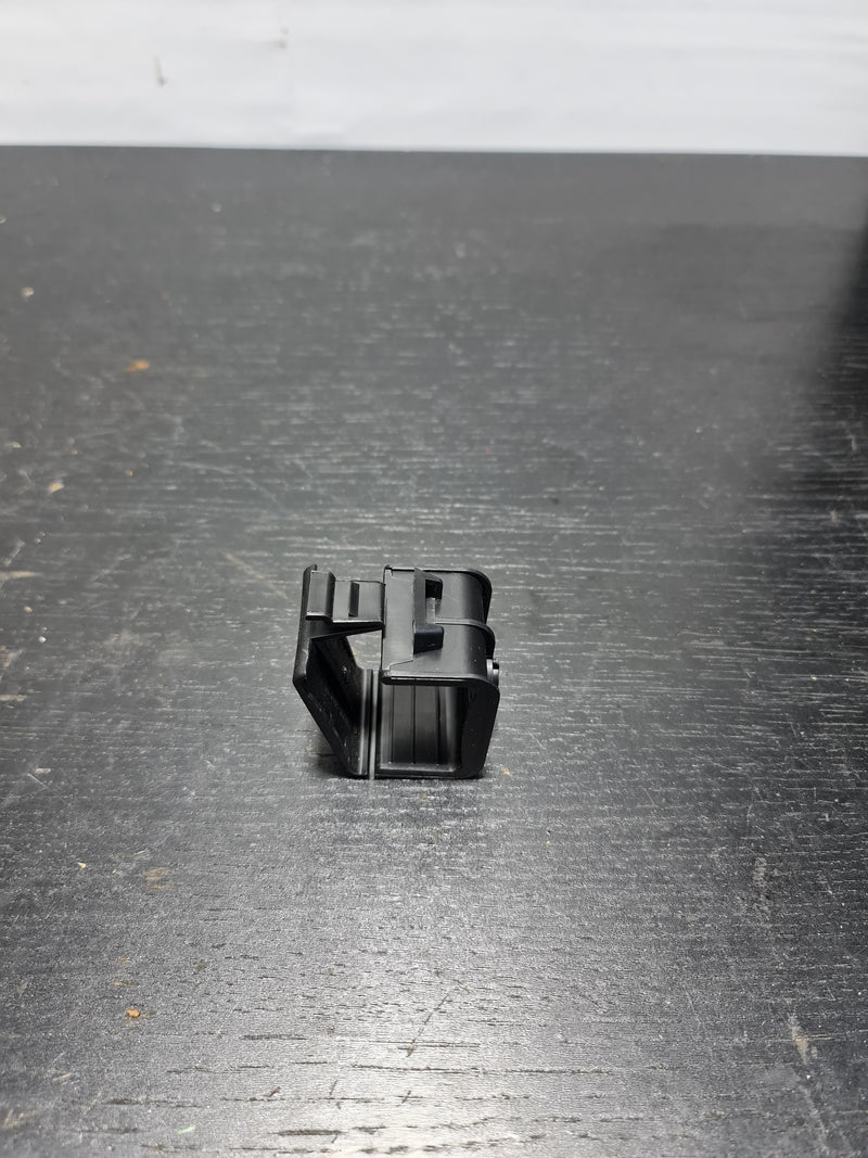BMW hazard warning triangle holder bracket clip by MPerformance.parts, showing the clamp and mounting details.
