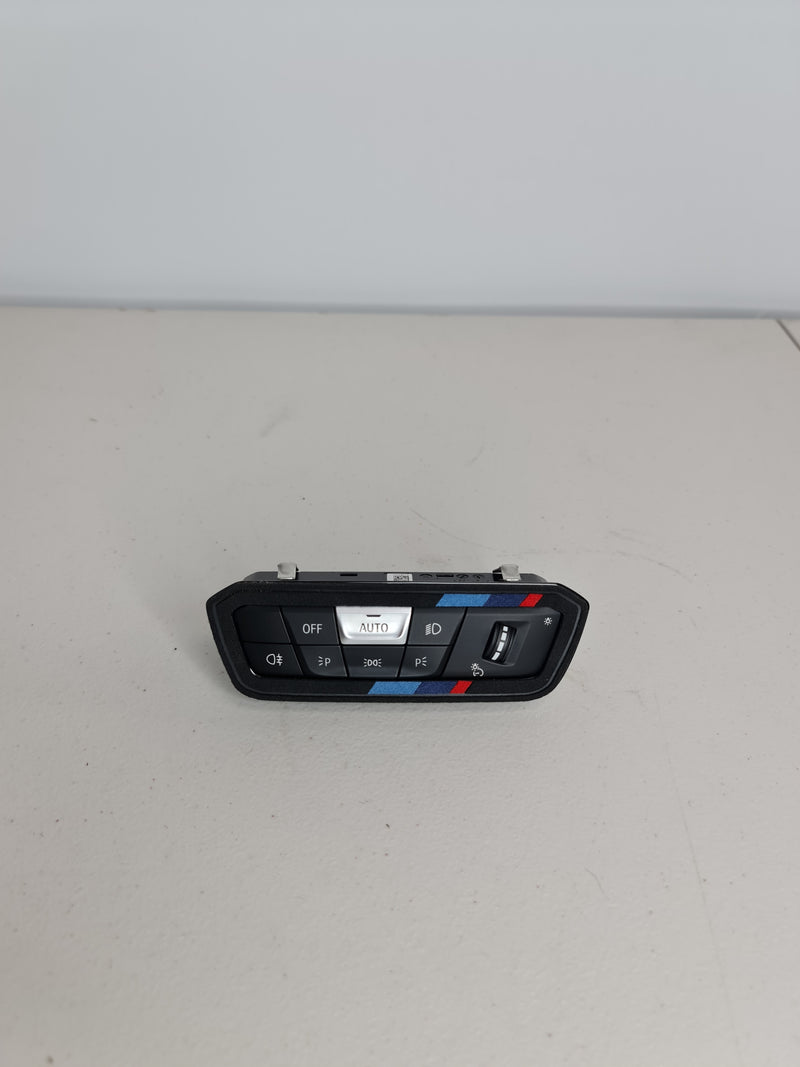 BMW G80 3/4 Series M3/M4 headlight control switch unit by MPerformance.parts, featuring switch and control buttons.