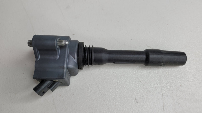 MPerformance.parts ignition coil for BMW 12138643360, close-up of black coil with electrical connectors.