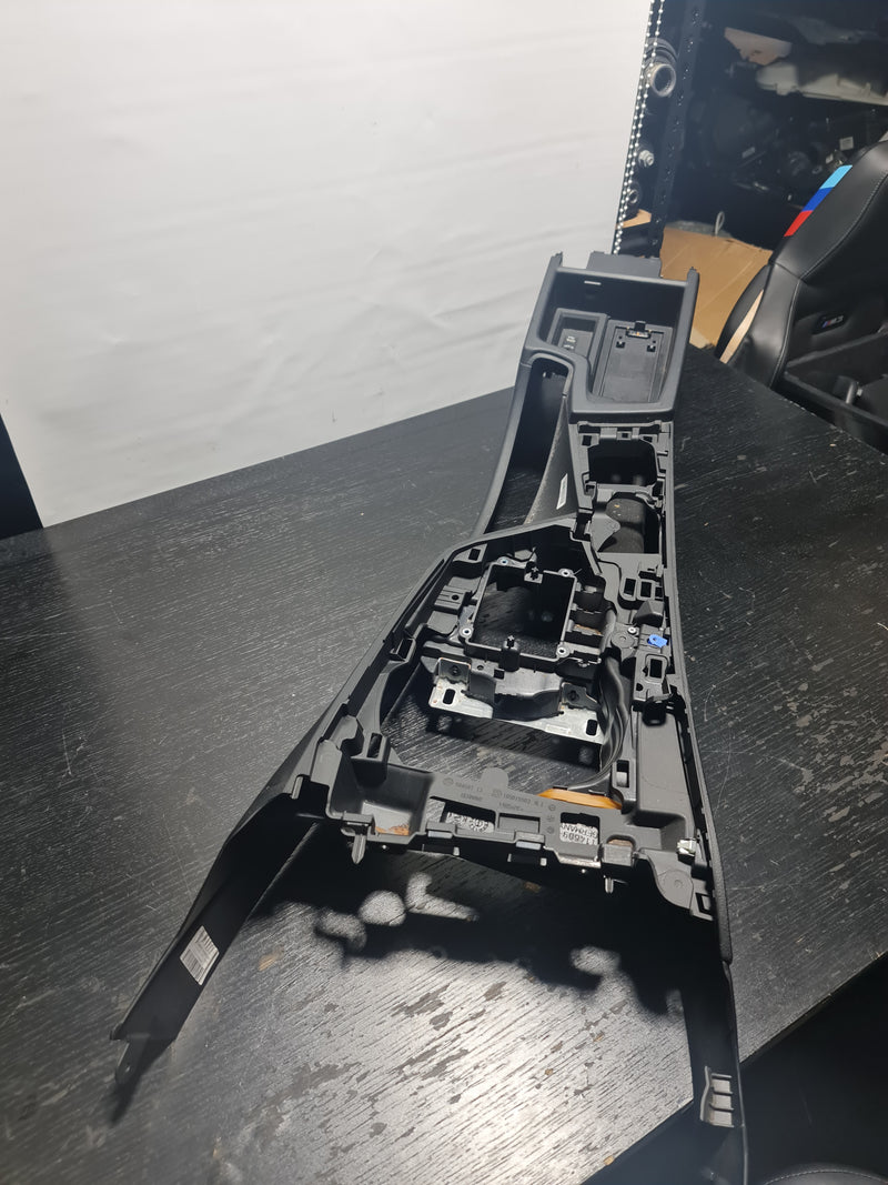 BMW M3 M4 F80 F82 2018 interior center console RHD by MPerformance.parts, showing the black plastic and gear shifter area.