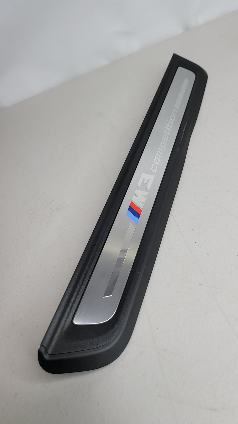 BMW G80 M3 Competition OEM front door sill kick plate by MPerformance.parts, black metal with embossed M3 logo.