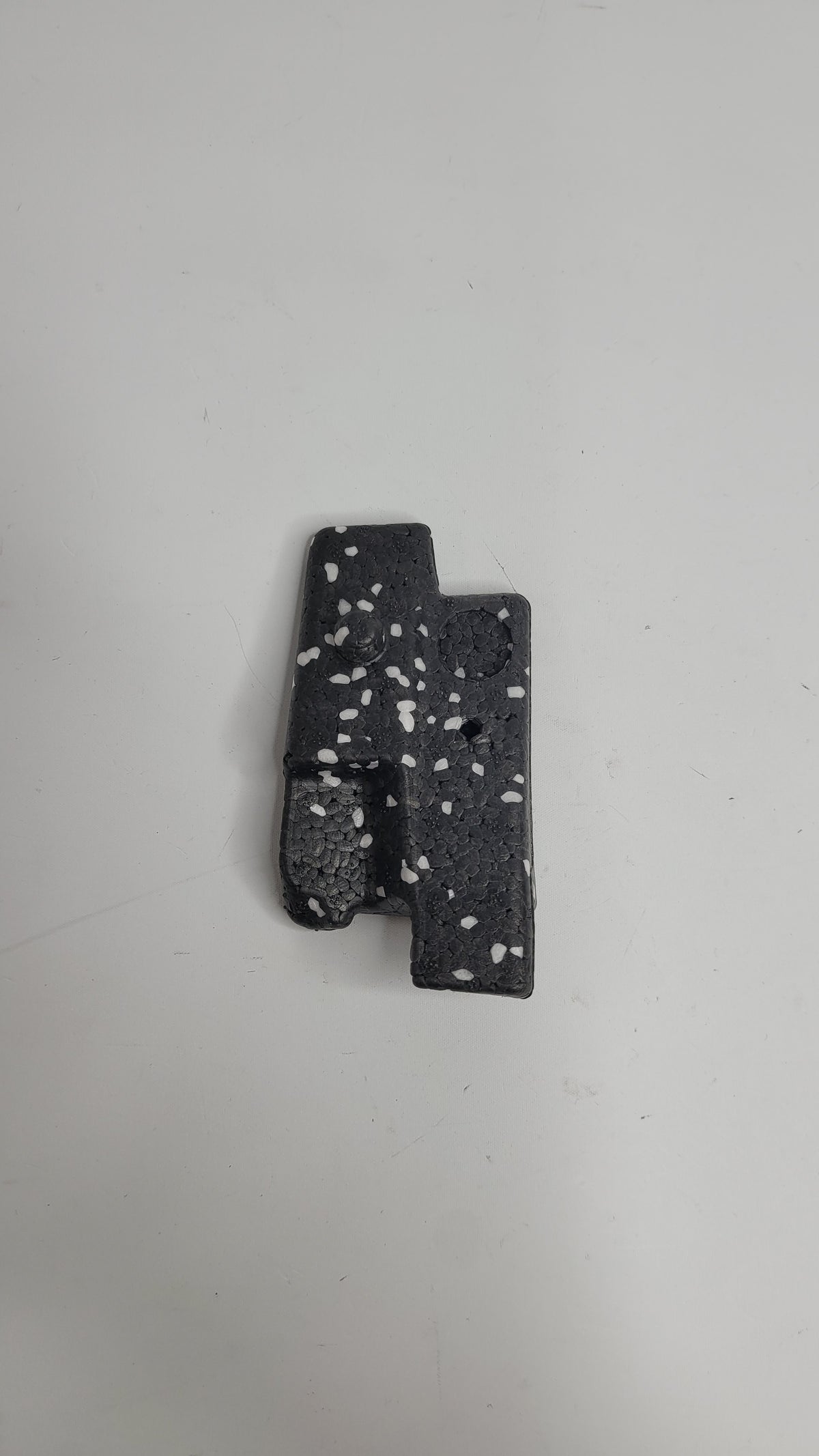 MPerformance.parts left side member pad for vehicle, close-up of black pad attached to the side member.