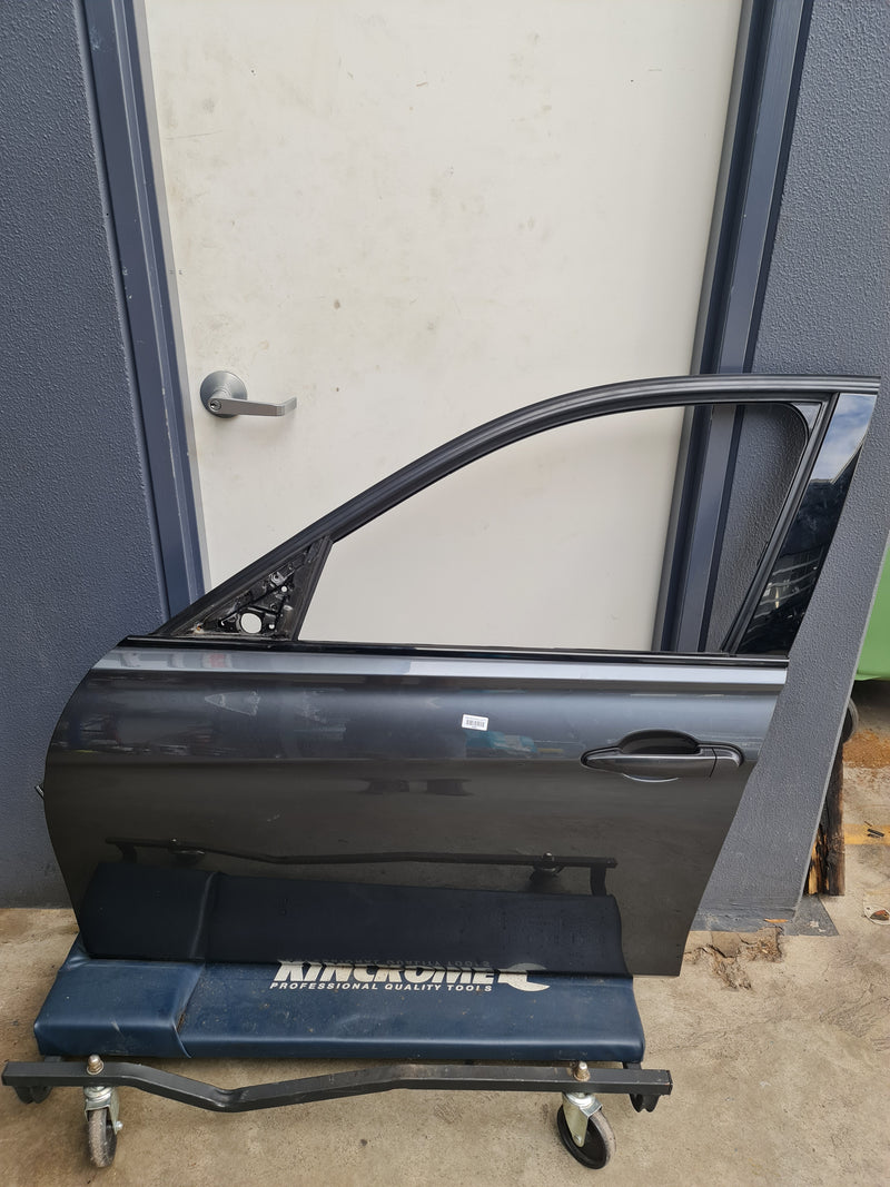 BMW F80 LCI M3 passenger door in grey, designed for 3 Series, from MPerformance.parts, with visible door handle and panel details.