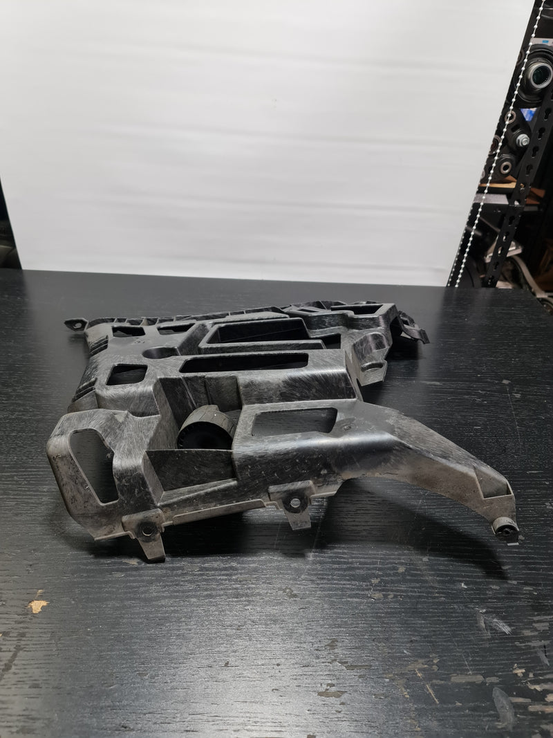 BMW G80 M3 rear left bumper holder bracket by MPerformance.parts, showing the black metal mounting component.