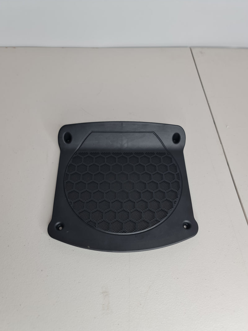 BMW G80 M3 M4 OEM subwoofer speaker cover by MPerformance.parts, black plastic cover with branding and mounting details.