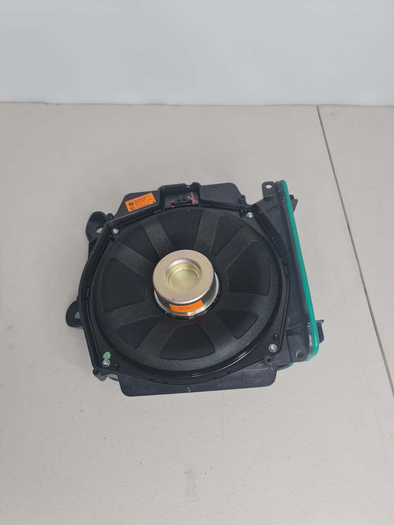 BMW M3 Competition G80 OEM floor under-seat subwoofer by MPerformance.parts, showing the compact car audio speaker installed under the seat.