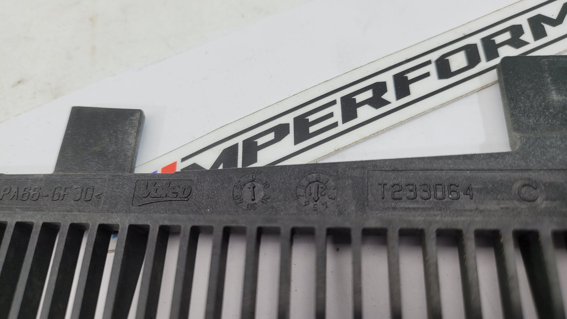 BMW G80 G82 G83 M3 M4 Competition plastic radiator cover shroud by MPerformance.parts, showing the black engine bay component.