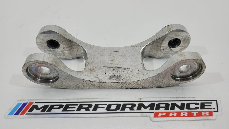 BMW M3 Competition G80 front subframe left side support bracket, part number 8746515, showing the metal bracket for engine stability.