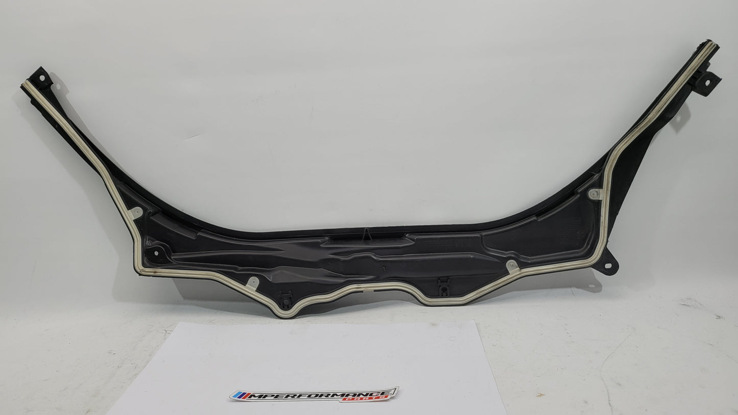 BMW M3 Series G8x upper firewall cover panel by MPerformance.parts, showing the sleek black metal design with mounting points.