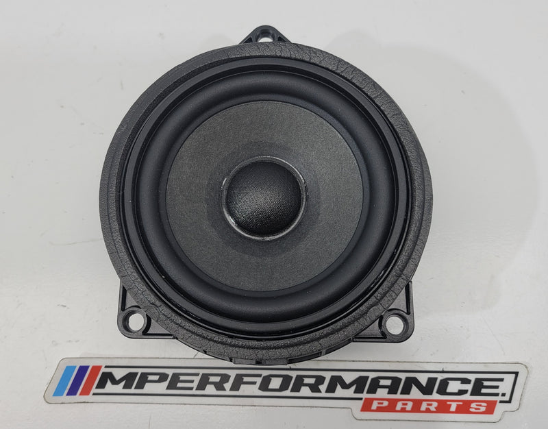 BMW G80 M3 front door speaker by MPerformance.parts, showing the black speaker with mounting hardware and branding details.
