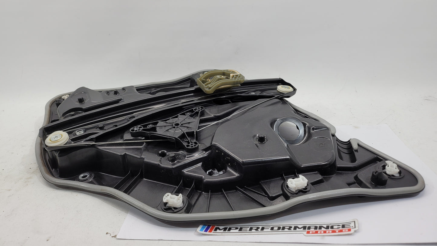 BMW M3 Series G20/G8x rear left window regulator and motor assembly, showing the new replacement part installed in the vehicle.