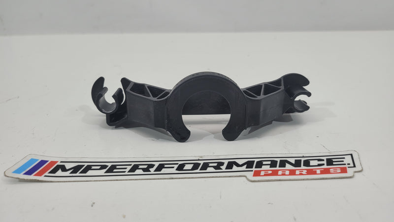 BMW M3 G80 G82 G83 intake silencer left bracket from MPerformance.parts, shown in black with mounting points visible.